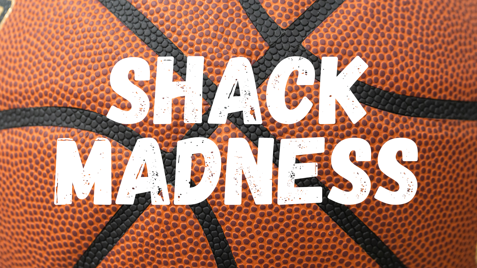 Close-up of a basketball with "Shack Madness" text overlay for Shane's Rib Shack March Madness BBQ catering.